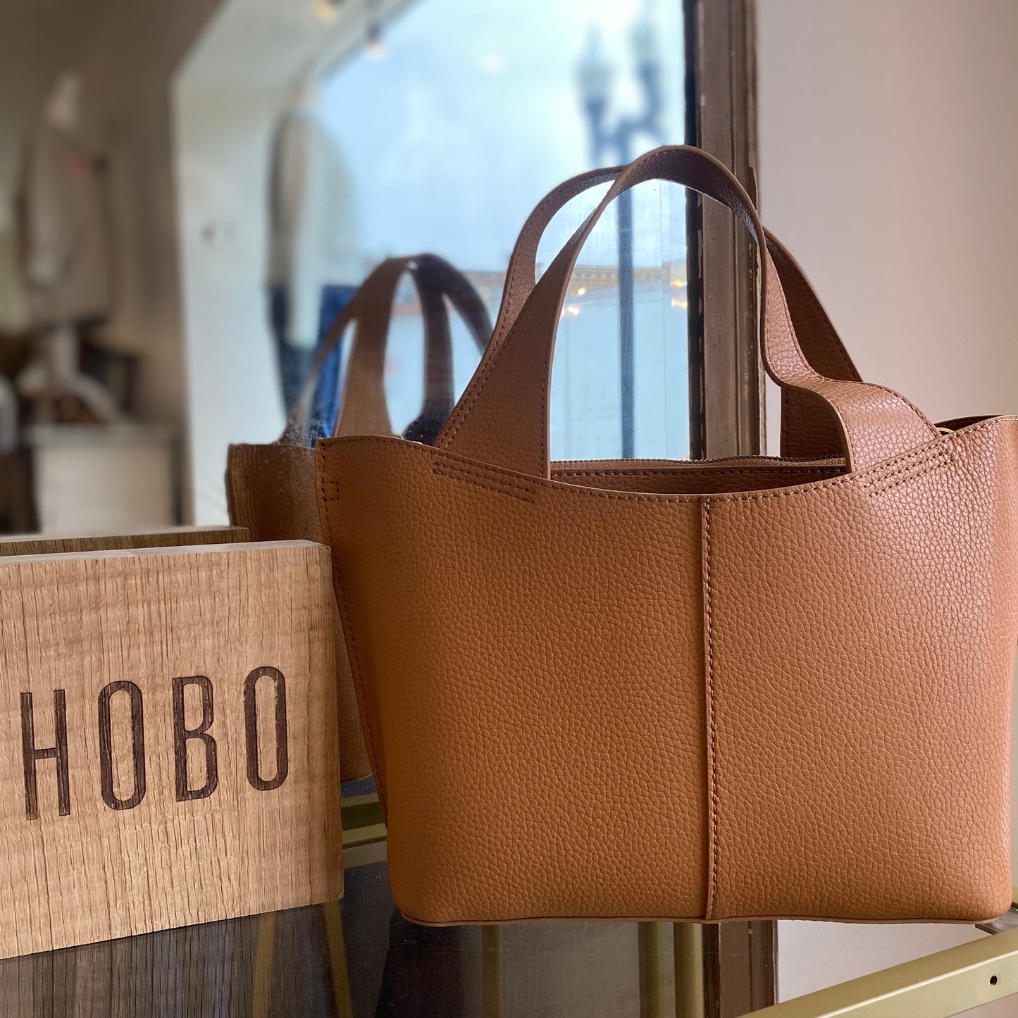 Vida Small Tote in Biscuit & Coconut Shell by HOBO